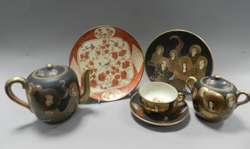 A Japanese Satsuma tea set comprising six cups and saucers, five side plates, a teapot, sugar box,