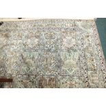 A large Indian kashmir silk rug the field filled wit rectangular panels of trees and flowers within