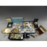 A large collection of various pieces of costume jewellery to include paste set brooches,