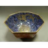 A Wedgwood Dragon lustre octagonal bowl, orange to the exterior, purple to the interior,