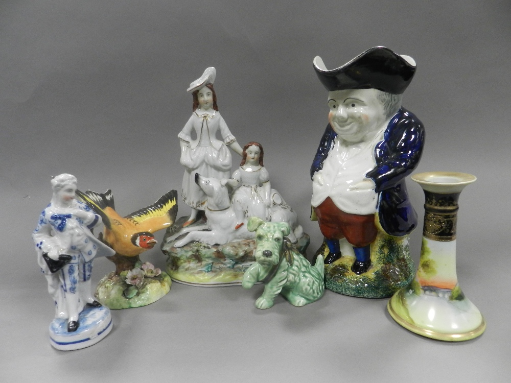 Decorative ceramics to two trays including Staffordshire figure groups, Staffordshire Toby jugs,