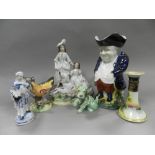 Decorative ceramics to two trays including Staffordshire figure groups, Staffordshire Toby jugs,