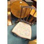 A 19th century oak dished top tripod table on pilaster column and three down curved legs,