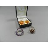 An amethyst set wreath brooch stamped 375 together with a 9ct gold garnet cluster ring and a pair