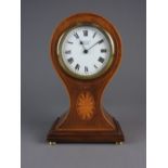 An Edwardian mahogany boxwood and harewood inlaid balloon shape mantel timepiece, 3.