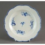 A Caughley plate painted with the Bright Sprigs pattern, circa 1785-93, S mark, 20.