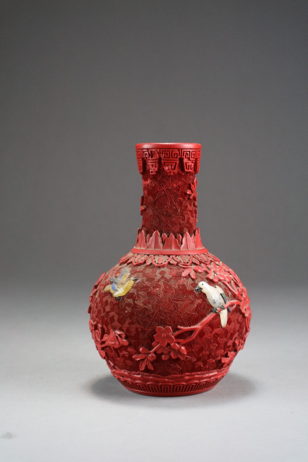 A Chinese inlaid cinnabar lacquer vase, late Qing/Republic period,