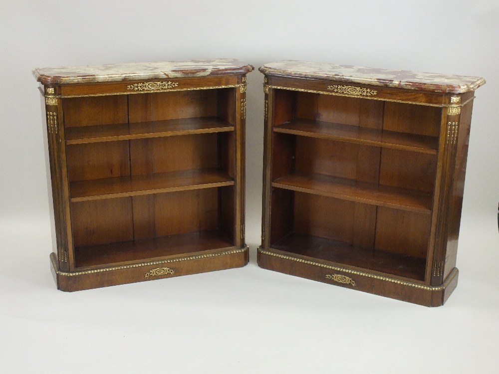 A pair of French marble ormolu mounted and walnut open bookcases, 19th century,