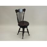 A Victorian mahogany music chair, possibly American,