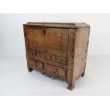 A Welsh vernacular oak table cabinet, 18th century, wit concave edge,