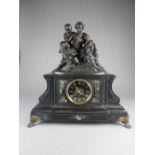 A French black marble mantle clock, 19th century, of breakfront rectangular form with 4.