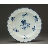 A pie-crust edge Caughley plate painted with the Gillyflower I pattern, circa 1776-1780, C mark 19.