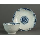 A Caughley tea bowl and saucer transfer-printed with Chrysanthemum and matching relief moulding,