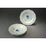 Three Caughley shallow dishes painted with the Carnation pattern between osier moulded borders,