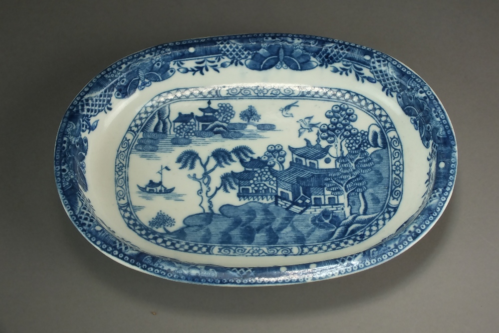 A Caughley oval baking dish transfer-printed in the Willow Nankin pattern, circa 1783-90,