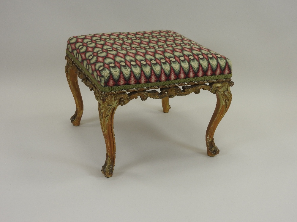 A carved giltwood framed foot stool mid 19th century,