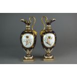 A pair of Mintons Anton Boullemier vases (one with repaired handle)