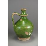 A medieval green glazed stoneware wine jug with single handle, 21.