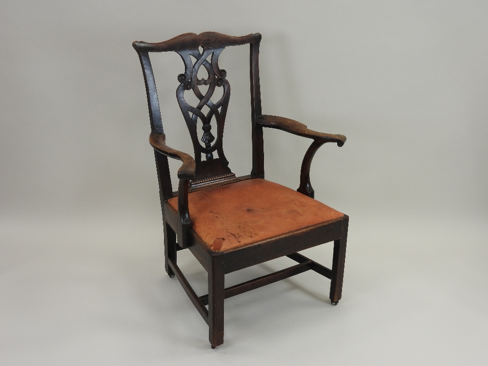 A George III mahogany open armchair, circa 1780, with shaped top rail and pierced vase splat,