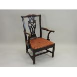 A George III mahogany open armchair, circa 1780, with shaped top rail and pierced vase splat,