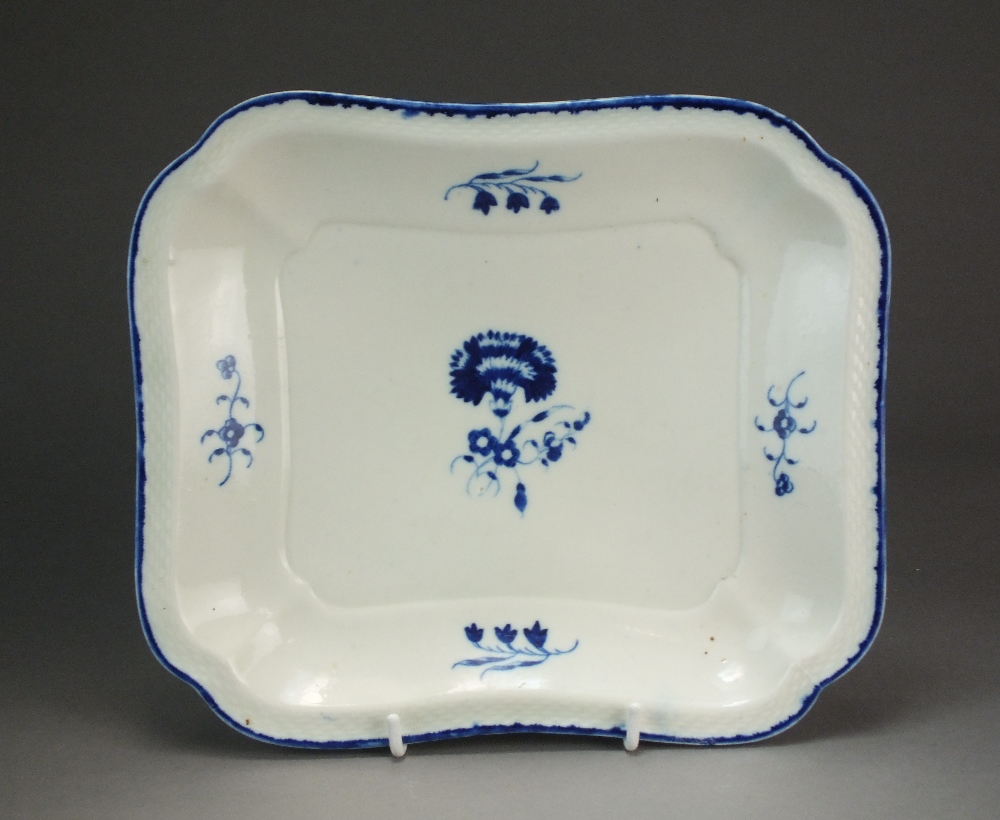 A Caughley square dessert dish painted with the Carnation pattern within a basket weave border,