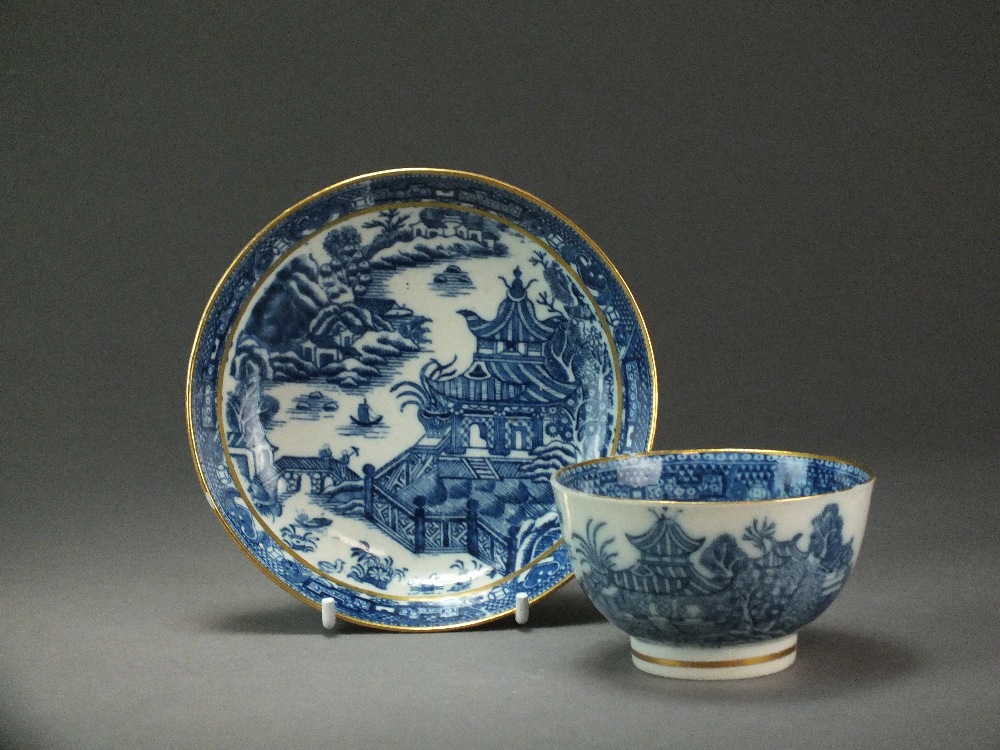 A Caughley tea bowl and saucer transfer-printed in the Striped Temple pattern, circa 1785-90,