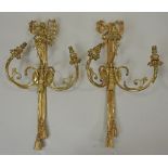 A pair of Louis XVI style gilt metal three branch wall lights, each of ribbon,