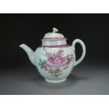 A Worcester polychrome teapot and matched cover, circa 1775, painted with a pink flower, 17.