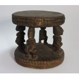 A carved wooden dogon stool from Mali, 24.