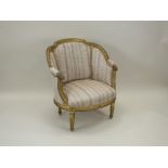 A Louis XVI style giltwood tub chair, late 19th/early 20th century,