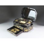 A Chinese export black lacquer sewing box, 19th Century, of canted rectangular form,