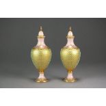 A pair of Coalport jewelled vases and covers,