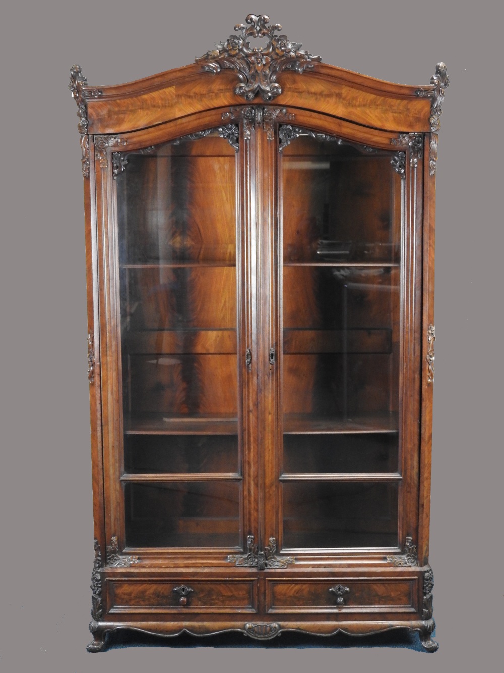 A continental figured mahogany armoire display cabinet, 19th century,