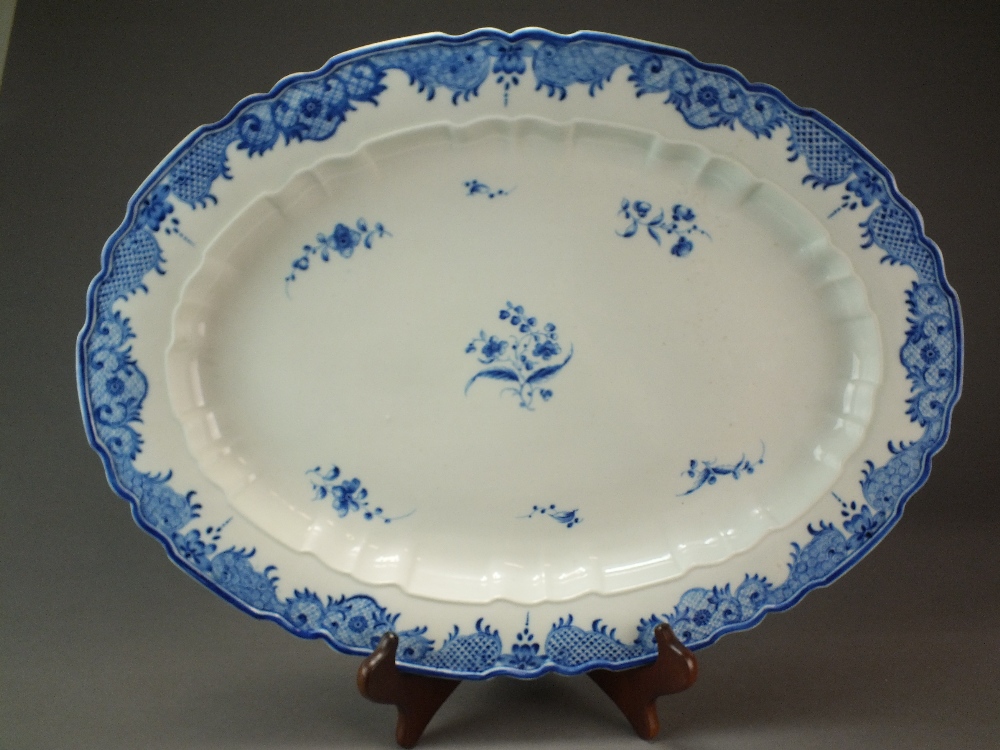A Caughley meat dish painted in the Salopian Sprigs pattern with a Règence border,