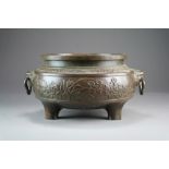 A large Chinese bronze tripod censer, ding, Xuande six-character mark but probably Qing Dynasty,