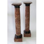 A pair of late 19th century French rouge marble column pedestals with Belgian black slate collars,