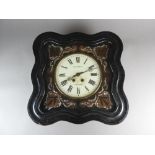 A French comtoise style wall clock, the shaped ebonised frame enclosing a 9.