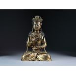 A Chinese gilt bronze figure of Guanyin, Qing Dynasty, modelled seated in dhyanasana,