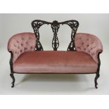 An early 20th century mahogany Chippendale style salon sofa,