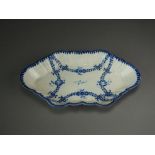 A Caughley spoon tray painted in a bright blue with the Rose Festoons pattern, circa 1785-90,