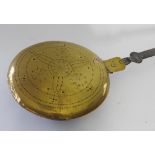 A late 17th century brass and steel warming pan