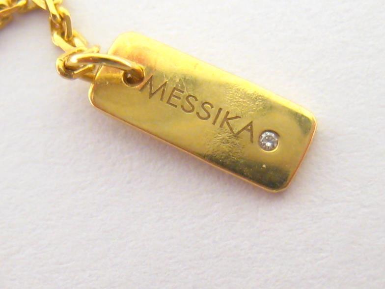 MESSIKA, 'Baby Move', an 18 carat gold and diamond necklace, the central open work oval pendant with - Image 5 of 5