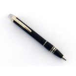 Montblanc, 'Starwalker', a black resin rollerball pen, with 'floating star' cap, no box or paperwork