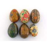 Six Russian finely painted and gilt wooden eggs, each about 6-7.5cm. long.