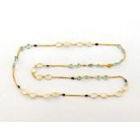 A sapphire, diamond, moonstone and aquamarine long chain, the fine gold chain spectacle set along