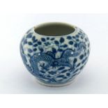 A Chinese blue and white water pot decorating with rolling dragon among flowers, Kangxi marks to the