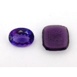 A loose oval cut amethyst, approx. 7.85 carat, together with a moulded glass intaglio (2)
