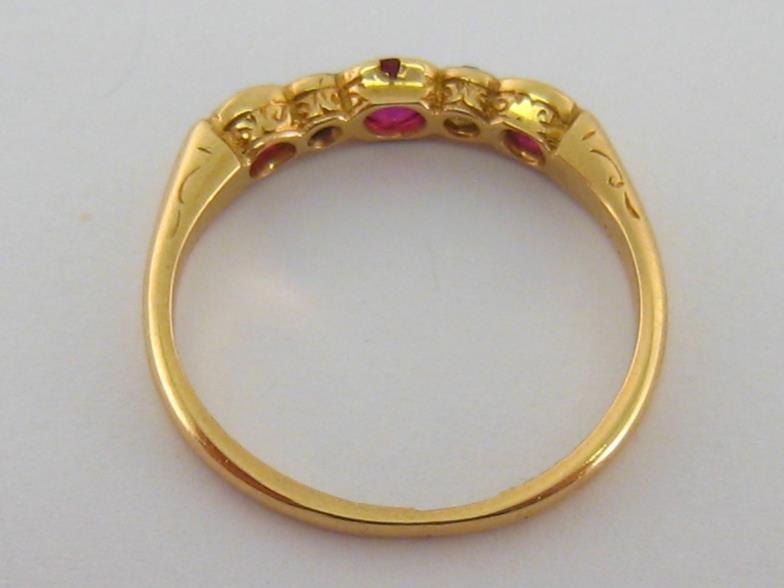 An early 20th century ruby and diamond five stone ring, composed of graduated alternate round cut - Image 2 of 3