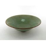 A Chinese celadon "Guan" type glazed bowl with tapering sides, edge break and restoration, 18th