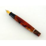 Laban, an orange and brown translucent marbled fountain pen, with broad nib and cartridge filler, in